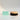 Gemology Cosmetics Paris blue amber soap with a sojourn ion dry body  brush, with wood and dense dark, natural  bristles  on a reflective surface,  and white background. 