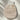 Sojourn Embrace Exfoliating Body Mitt, made of hemp, linen, cotton and copper fabric, placed on a light surface with soft natural reflections.