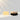 Gemology Cosmetics Paris opal soap with a sojourn ion dry body  brush, with wood and dense dark, natural  bristles  on a reflective surface,  and white background. 