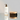 Gemology Cosmetics Paris hair and body gel with a sojourn ion dry body  brush, with wood and dense dark, natural  bristles  on a reflective surface,  and white background. 